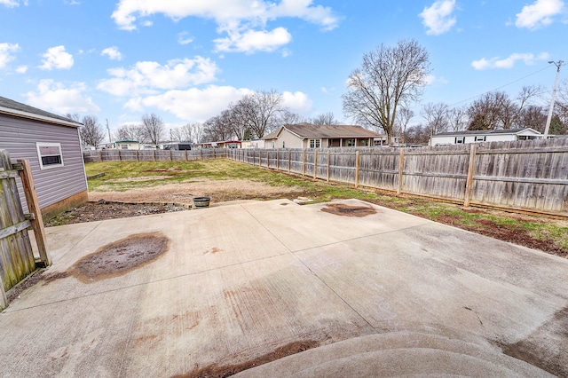 view of patio / terrace featuring a residential view and a fenced backyard