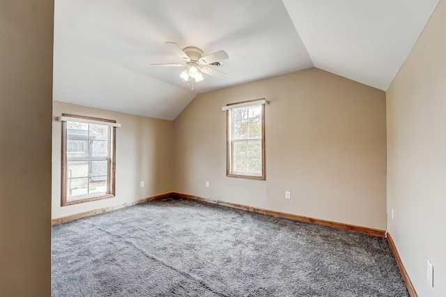 additional living space featuring lofted ceiling, carpet flooring, baseboards, and ceiling fan