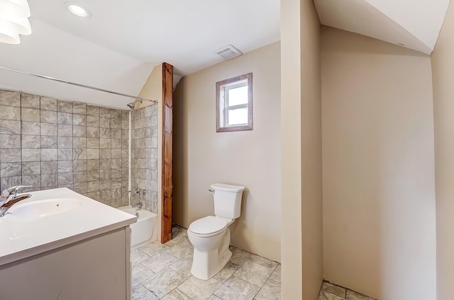 full bath with visible vents, toilet, vaulted ceiling, bathing tub / shower combination, and vanity