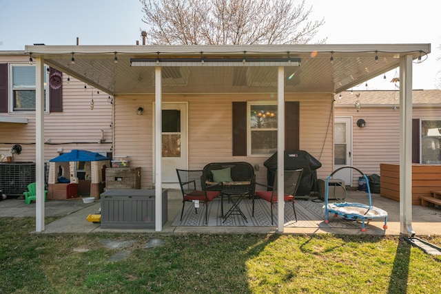 back of house with a yard and a patio area