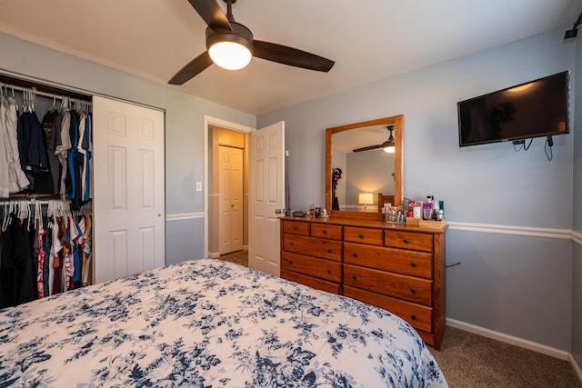 carpeted bedroom featuring a closet, a ceiling fan, and baseboards