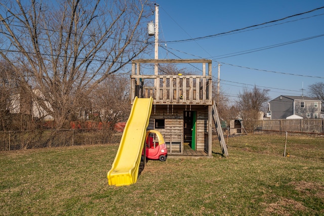 view of playground featuring a yard and fence