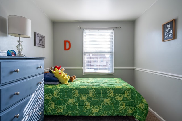 bedroom featuring carpet flooring and baseboards