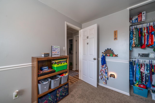 game room with baseboards and carpet