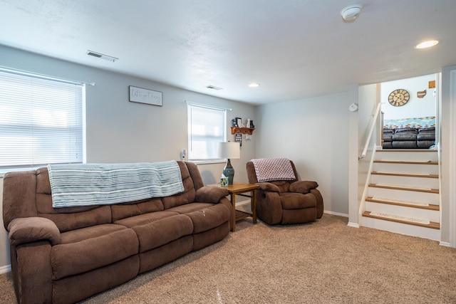 carpeted living room featuring visible vents, recessed lighting, stairs, and baseboards