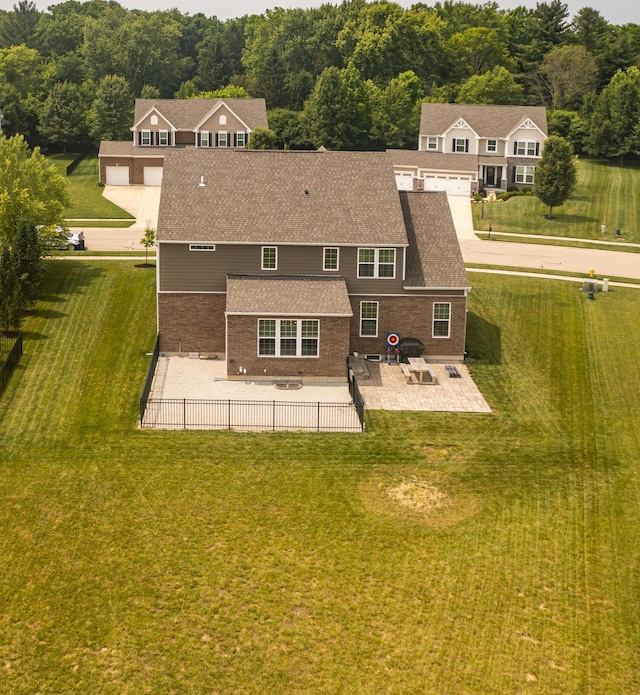 8754 Elysee Cir, Washington Twp, OH 45458 - back of house with a patio, brick siding, and a shingled roof