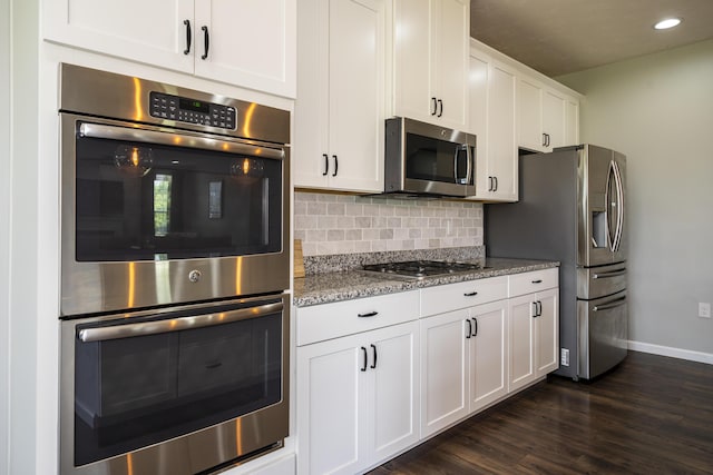 8754 Elysee Cir, Washington Twp, OH 45458 - kitchen featuring stainless steel appliances, decorative backsplash, light stone countertops, white cabinetry, and dark wood-type flooring
