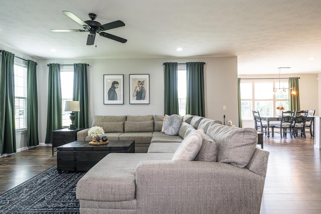 8754 Elysee Cir, Washington Twp, OH 45458 - living room with healthy amount of natural light, ceiling fan, dark wood-style floors, a chandelier, and recessed lighting