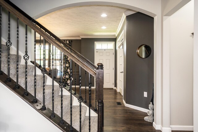 8754 Elysee Cir, Washington Twp, OH 45458 - foyer entrance with arched walkways, ornamental molding, wood finished floors, recessed lighting, and stairway