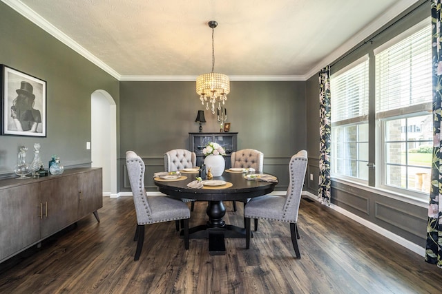 8754 Elysee Cir, Washington Twp, OH 45458 - dining space featuring arched walkways, a chandelier, wood finished floors, and crown molding