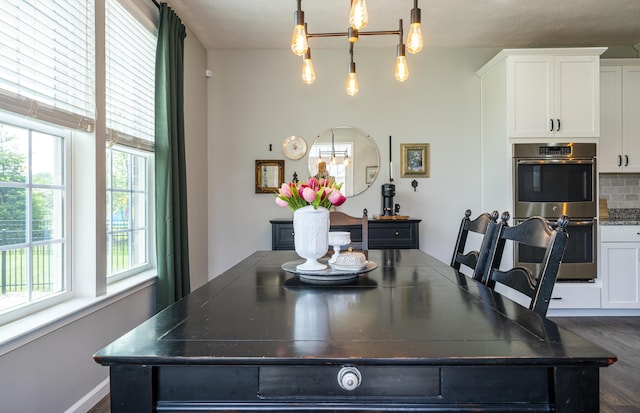 8754 Elysee Cir, Washington Twp, OH 45458 - dining space featuring a chandelier and dark wood-style flooring