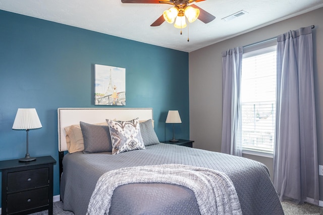 8754 Elysee Cir, Washington Twp, OH 45458 - carpeted bedroom with multiple windows and ceiling fan