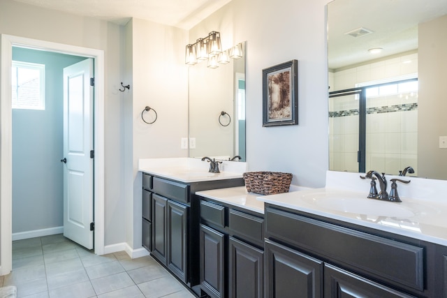 8754 Elysee Cir, Washington Twp, OH 45458 - full bath with double vanity, plenty of natural light, tile patterned flooring, and tiled shower