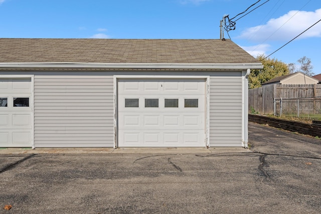 garage featuring fence