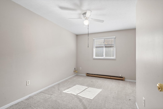 empty room featuring baseboards, a baseboard heating unit, a ceiling fan, and light colored carpet