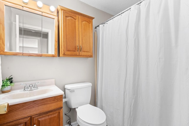 full bathroom with vanity and toilet