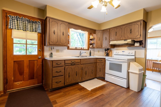 704 Campbell Rd, Sidney, OH 45365 - kitchen featuring a sink, open shelves, dark wood-type flooring, under cabinet range hood, and white range with electric stovetop