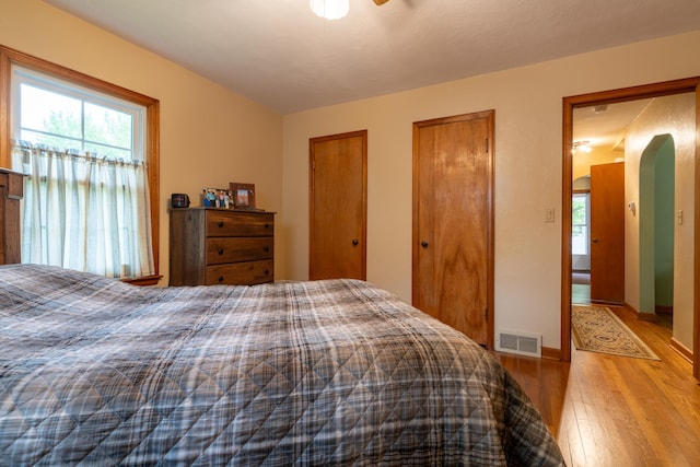 704 Campbell Rd, Sidney, OH 45365 - bedroom featuring multiple closets, visible vents, and wood finished floors