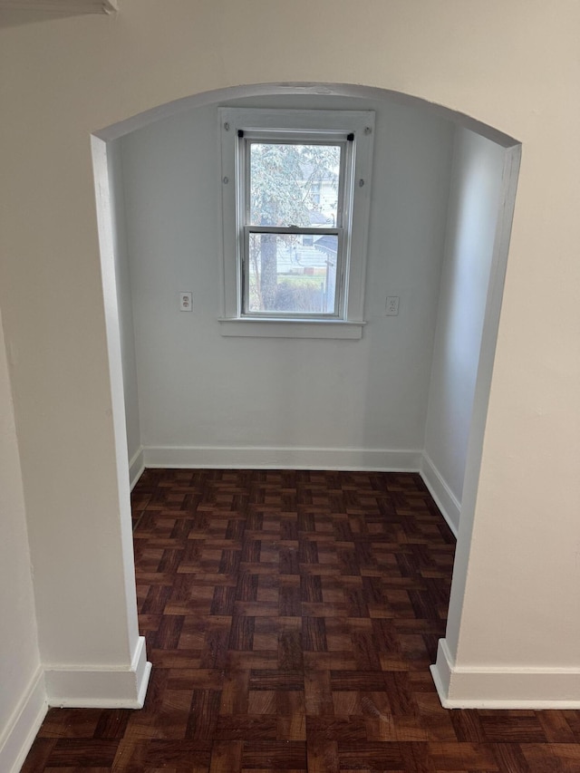 interior space with dark parquet flooring