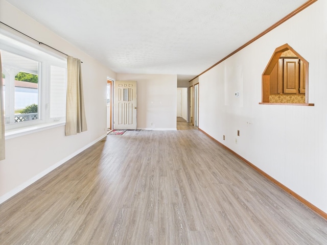 173 Front St, West Milton, OH 45383 - unfurnished living room featuring light wood finished floors and baseboards