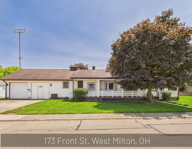 173 Front St, West Milton, OH 45383 - single story home with driveway, a garage, and a front yard