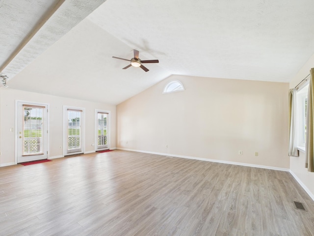173 Front St, West Milton, OH 45383 - unfurnished living room featuring ceiling fan, vaulted ceiling, and light wood-style floors