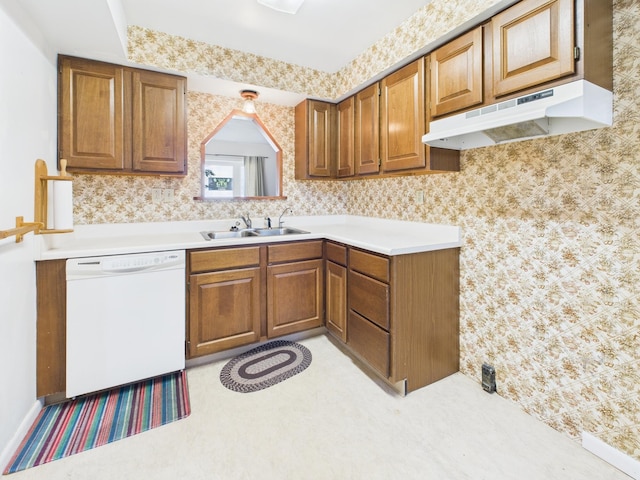 173 Front St, West Milton, OH 45383 - kitchen featuring white dishwasher, under cabinet range hood, brown cabinetry, and light countertops