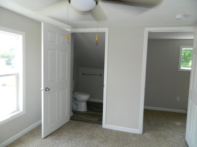 16 E Walnut St, Jeffersonville, OH 43128 - unfurnished bedroom featuring light carpet, connected bathroom, and baseboards