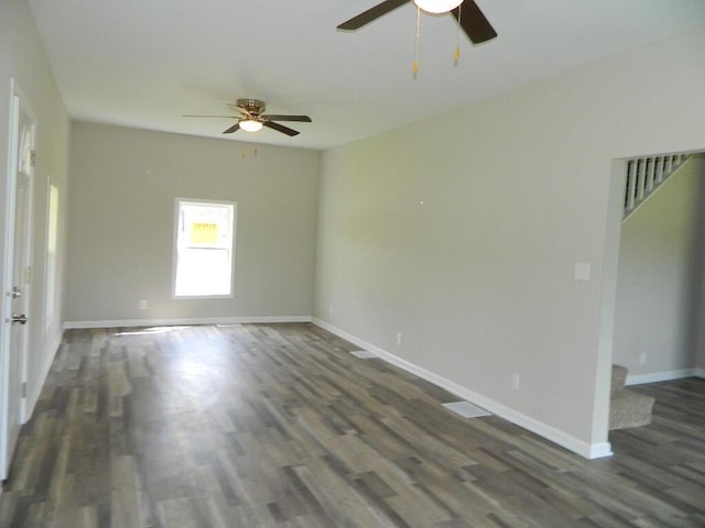 16 E Walnut St, Jeffersonville, OH 43128 - spare room with a ceiling fan, dark wood-style floors, and baseboards