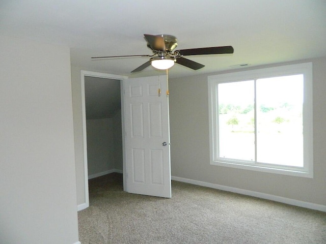 16 E Walnut St, Jeffersonville, OH 43128 - unfurnished bedroom featuring light carpet, baseboards, a spacious closet, ceiling fan, and a closet