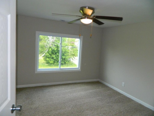 16 E Walnut St, Jeffersonville, OH 43128 - unfurnished room with a ceiling fan, carpet floors, and baseboards