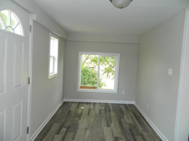 16 E Walnut St, Jeffersonville, OH 43128 - unfurnished room with dark wood-style flooring and baseboards