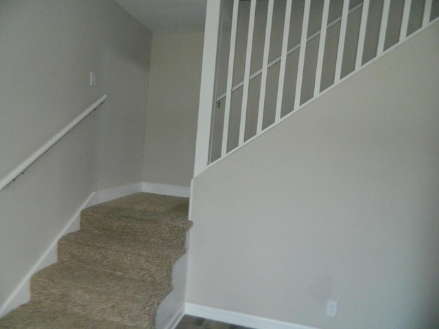 16 E Walnut St, Jeffersonville, OH 43128 - stairs with carpet and baseboards