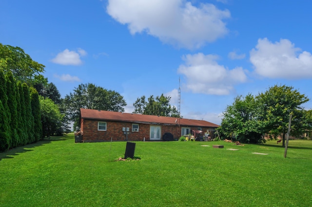 3847 Drew Rd, Arcanum, OH 45304 - rear view of house featuring a lawn