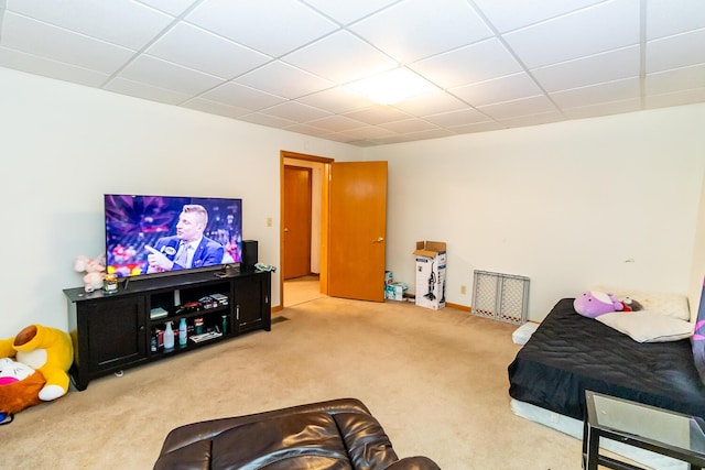 carpeted bedroom featuring a paneled ceiling