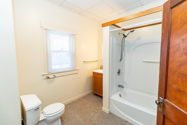 full bathroom with vanity, toilet,  shower combination, and a drop ceiling