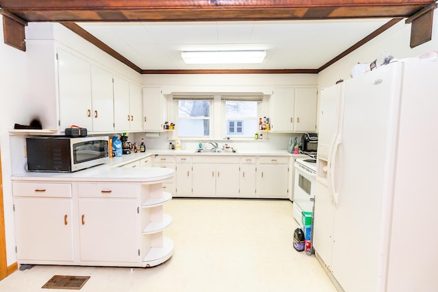 kitchen featuring sink, white appliances, ornamental molding, and white cabinets