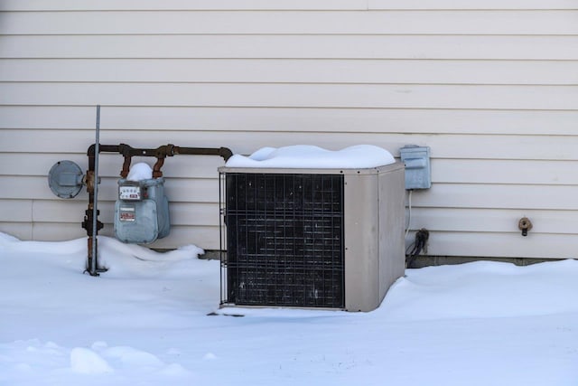 exterior details featuring gas meter and cooling unit