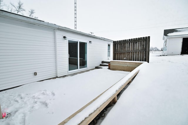 view of snow covered deck