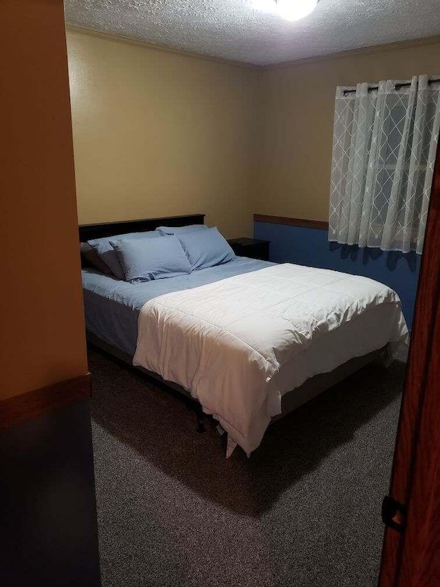 1607 Nagel St, Saint Marys, OH 45885 - carpeted bedroom featuring a textured ceiling