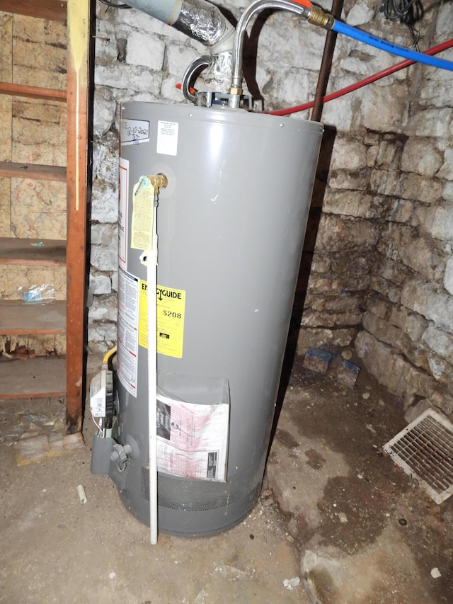 utility room with visible vents and gas water heater