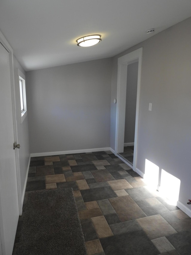 empty room with baseboards