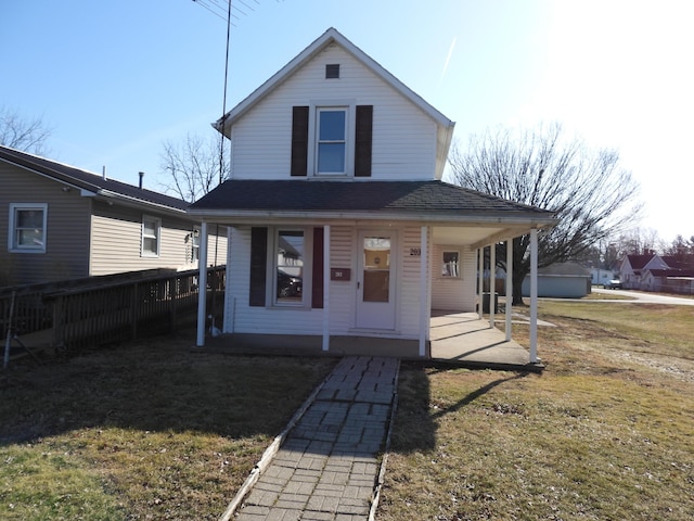 view of front of house featuring a porch and a front yard