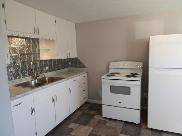 kitchen with white cabinetry, white appliances, backsplash, and a sink