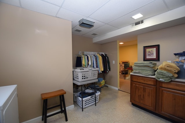 bedroom featuring a paneled ceiling and a closet