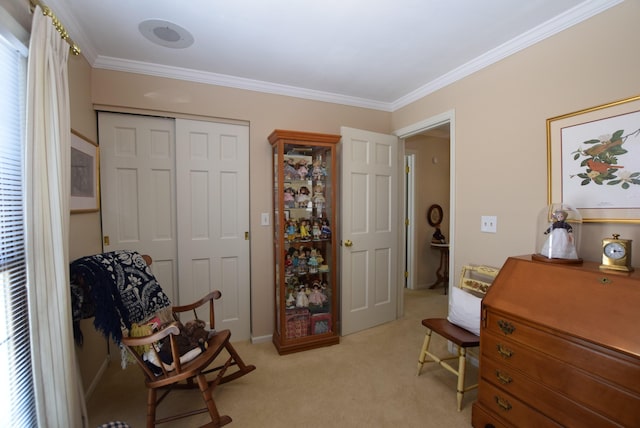 sitting room with light carpet and ornamental molding