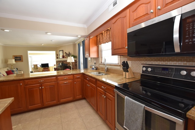 kitchen with sink, crown molding, kitchen peninsula, stainless steel appliances, and backsplash