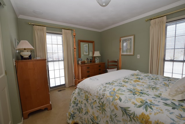 carpeted bedroom with ornamental molding