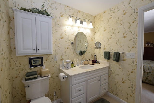 bathroom featuring vanity and toilet