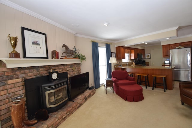 living room with crown molding, light colored carpet, sink, and a wood stove